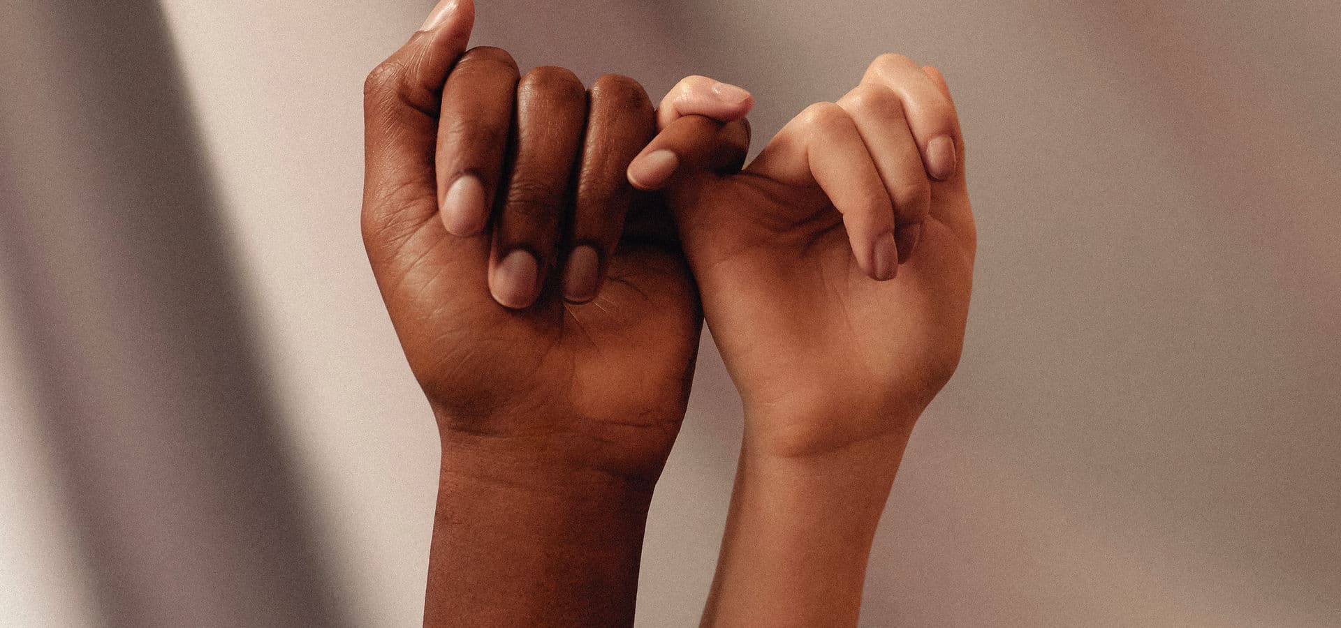 Hands clasped together representing connection